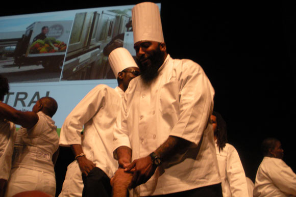 Earl Pass receives a congratulatory handshake after graduating from DC Central Kitchen's culinary jobs training program. Pass spent 13 years in prison and credits the program for helping him move past a life of "death or incarceration"